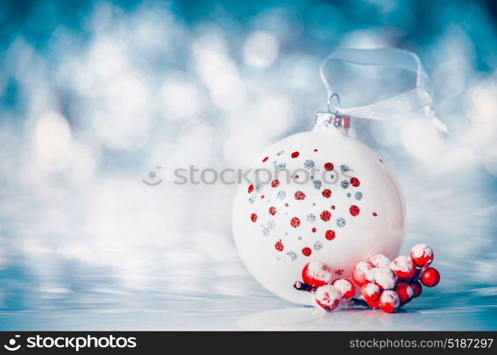 Christmas background with balls and red festive decoration at winter bokeh background, front view, banner