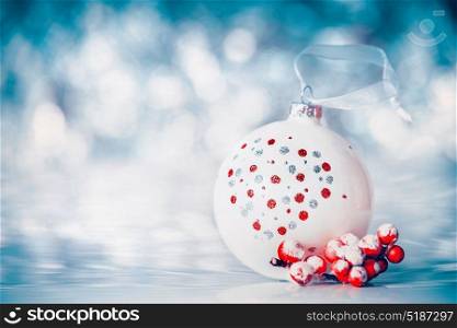 Christmas background with balls and red festive decoration at winter bokeh background, front view, banner