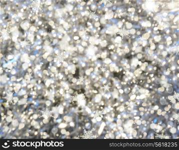 Christmas background with bokeh lights and snowflakes