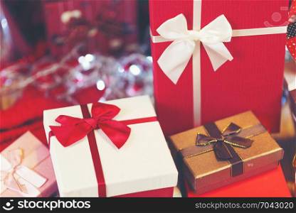 Christmas background with decorations and gift boxes on wooden board