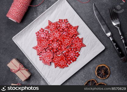 Christmas background with decorations. New Year symbol - decorative fir tree. Christmas composition made of christmas decoration on a dark background.