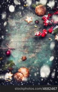 Christmas background with fir branches, cookies , gingerbreads and snow, top view frame, vertical