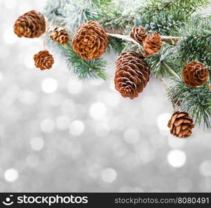 Christmas background with fir branches,pinecones and berries on the old wooden board in vintage style