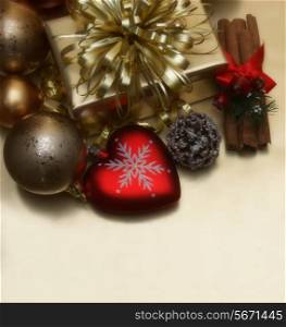 Christmas background with gift and heart shaped bauble