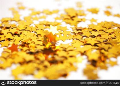Christmas background with golden stars close-up