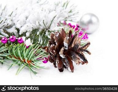 Christmas background with pine cone, bead and fir branch