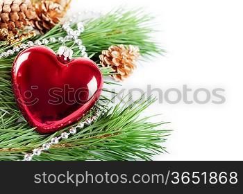 Christmas background with red heart and pine branch