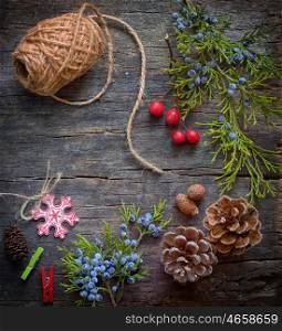 Christmas background with rope, branches, pine cones decoration