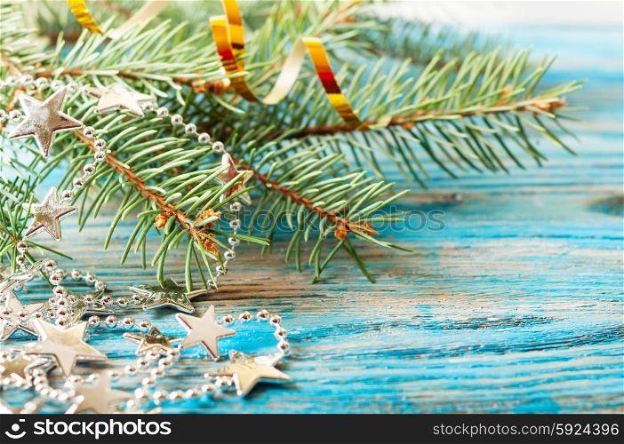 Christmas background with silver decorations and fir branch