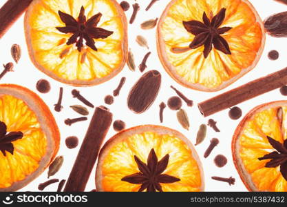 Christmas background with spices and dry orange&#39;s slices