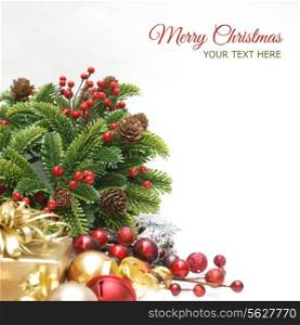 Christmas background with wreath, gift, berries and baubles - focus on the wreath