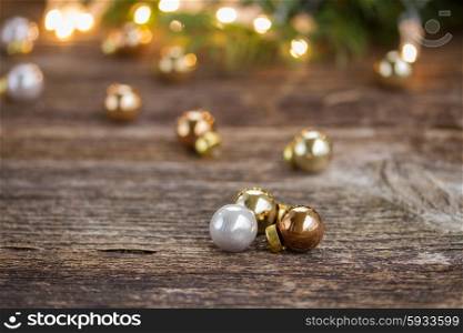 christmas background - wooden table with glass balls and defocused lights and decorationd. christmas background with lights
