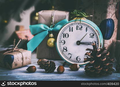 Christmas backgrounds. Gifts and Christmas decor on the wooden background.