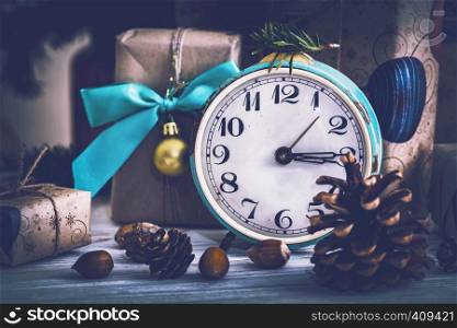 Christmas backgrounds. Gifts and Christmas decor on the wooden background.