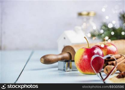 Christmas Baking background. Ingredients for cooking christmas baking on white wood background with copy space.