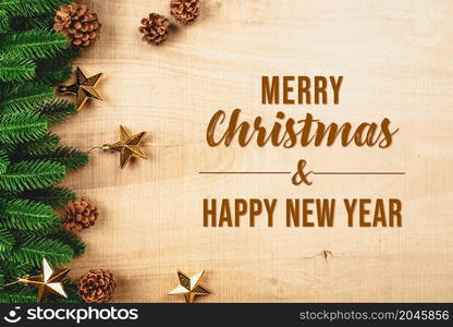 Christmas ball and pine tree with xmas decoration on wooden background