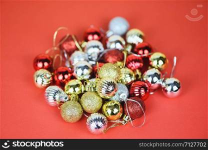 Christmas ball decoration for pine tree with colorful golden silver and red balls holiday red background / christmas tree festive xmas winter and Happy New Year object concept