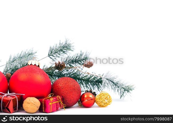 Christmas balls and fir branch on white background
