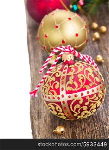 christmas balls decorations on wooden background border isolated on white . christmas balls on wooden background border