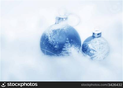 Christmas balls frozen in soft cotton wool resembling snow