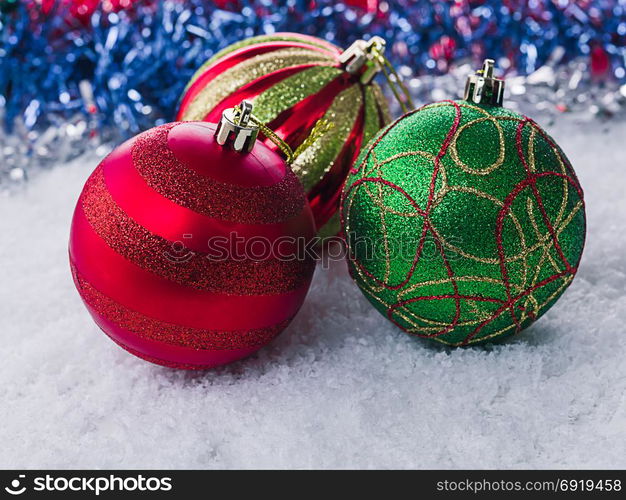 Christmas balls in the snow. Blurred Blue Background