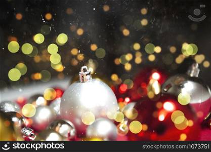 Christmas balls in winter setting,Winter holidays concept. Bokeh background