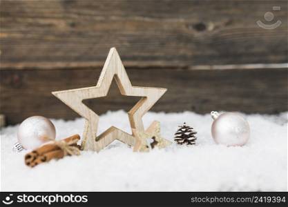 christmas balls near wood articles snow