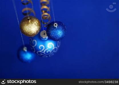 christmas balls on blue satin background