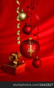 christmas balls on red satin background