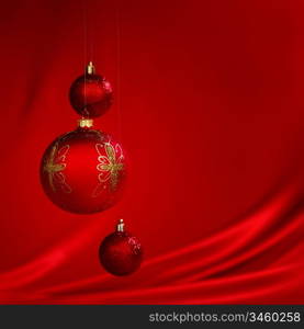 christmas balls on red satin background