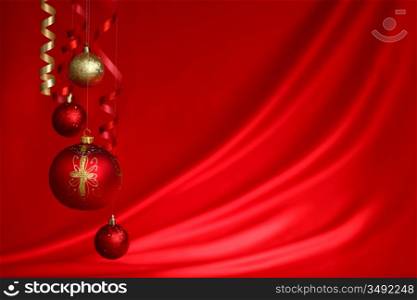 christmas balls on red satin background
