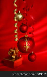christmas balls on red satin background