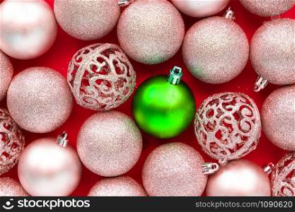 Christmas baubles decoration on red background.
