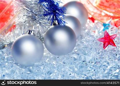 christmas baubles silver on winter ice with star symbol shapes