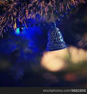 Christmas. Beautiful Christmas ornament on the Christmas tree. Seasonal background for winter holidays.