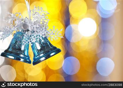 Christmas bells against defocused background with shallow depth of field and copyspace
