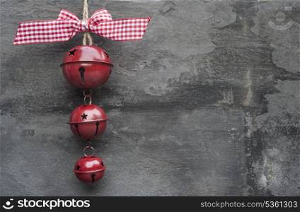 Christmas bells ornament on rustic style grunge background