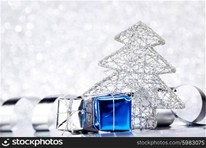 Christmas blue decoration on shiny silver glitter background