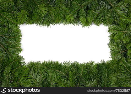 Christmas border arranged with fresh fir branches isolated on white background , copy space for text. Christmas border of fir branches