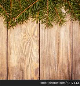 Christmas border evergreen on the wooden background