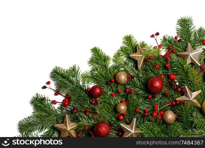 Christmas Border frame of tree branches on white background with copy space isolated, red and golden decor, berries, stars. Christmas frame of tree branches