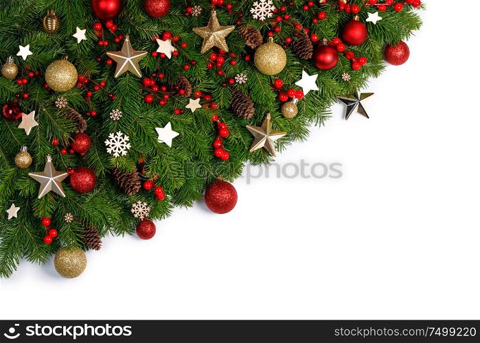 Christmas Border frame of tree branches on white background with copy space isolated, red and golden decor, berries, stars,. Christmas frame of tree branches