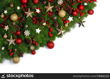 Christmas Border frame of tree branches on white background with copy space isolated, red and golden decor, berries, stars,. Christmas frame of tree branches