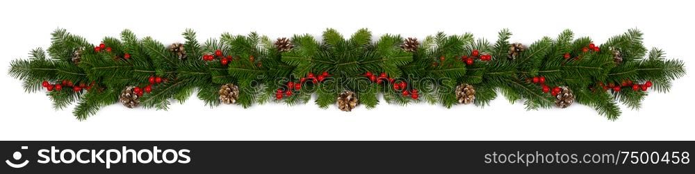 Christmas Border frame of tree branches red berries and pine cones on white background with copy space isolated. Christmas frame of tree branches