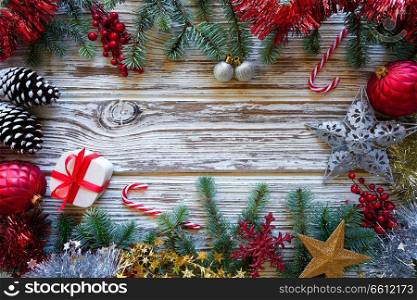 Christmas border frame on white wooden background