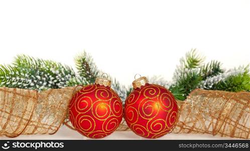 Christmas border from branch and balls on white background