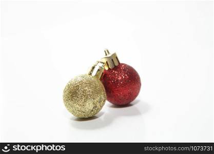Christmas border of gold ornaments and branches isolated on a white background