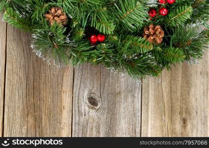 Christmas border with decorative wreath on rustic wooden boards.