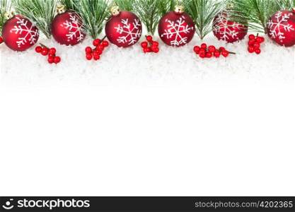Christmas border with red ornaments and pine branches