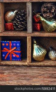 Christmas box with trinkets. Vintage wooden box with compartments in which Christmas toys and gifts